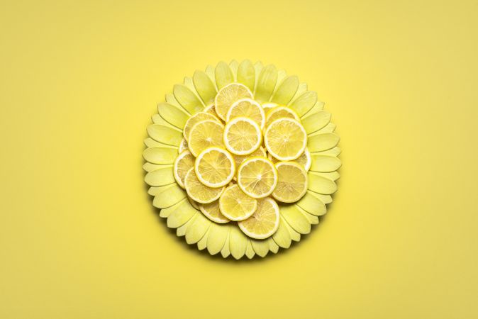 Lemon slices on yellow flower plate