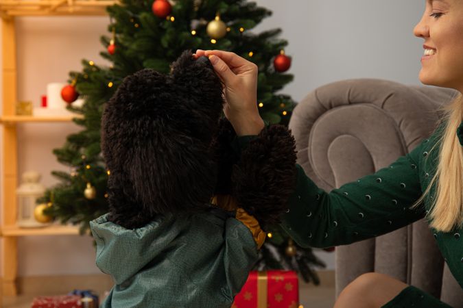 Concept of Merry Christmas, young woman play with dog