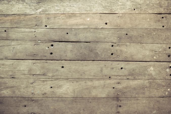 Brown wooden board floor with nails