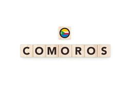 Wooden blocks bearing the name and flag of Comoros.