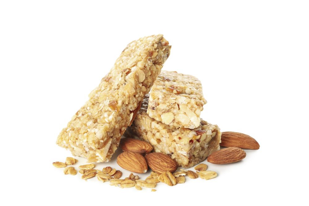 Tasty granola bars isolated on blank background