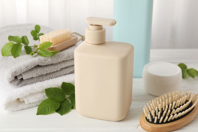 Composition with hair care products on wood table