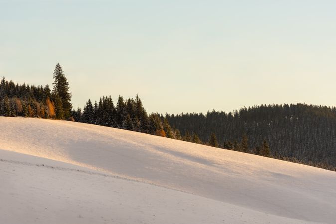 Mountains covered in deep snow at sunrise