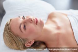Blonde woman lying back for beauty treatment bDjlyE