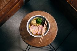 Bowl of delicious ramen soup served in restaurant