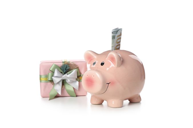Concept of Christmas finance with piggy bank, isolated on light background