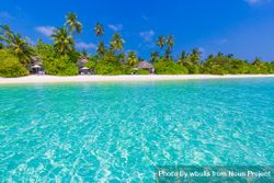 Beach front in the Maldives with clear blue water 4dyqAb