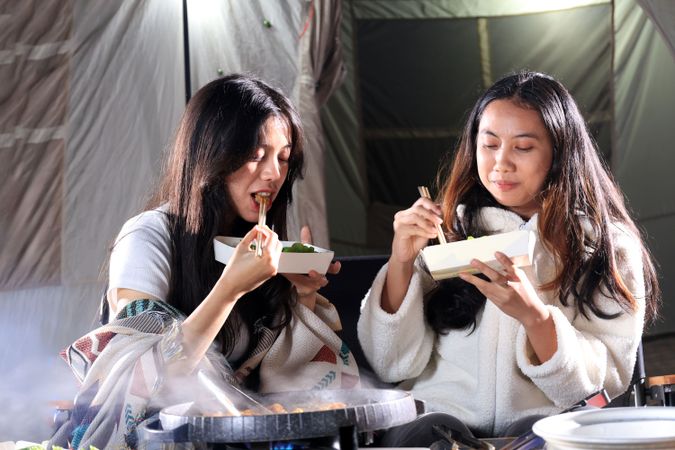 Two Female Friend Barbeque in front of Camping Tent