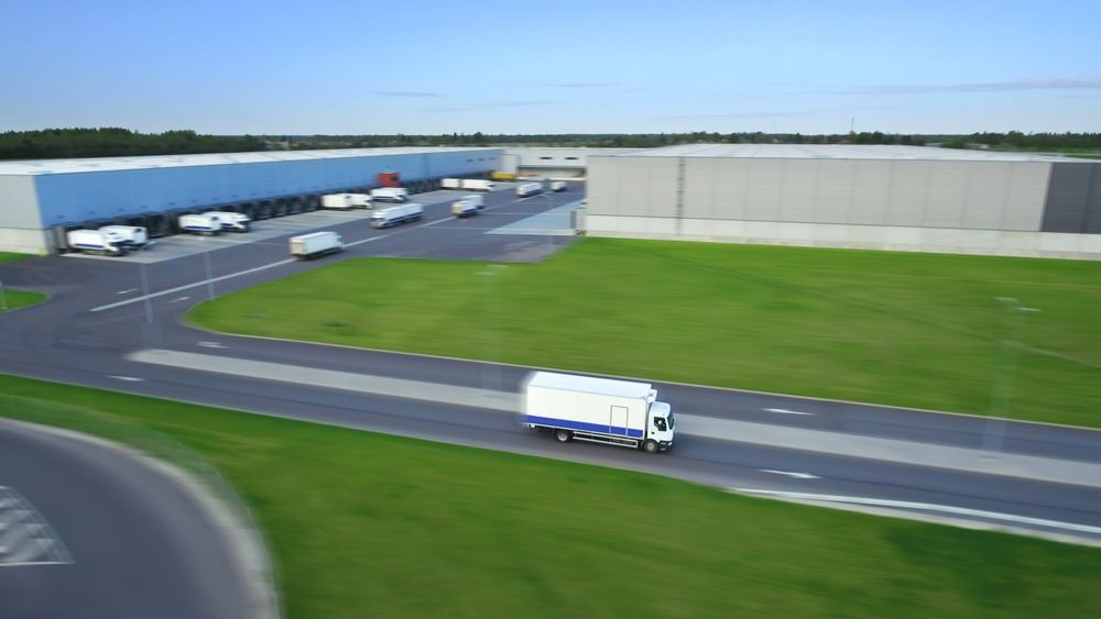 A Fleet of Trucks Efficiently Navigates a Vast Logistics Hub