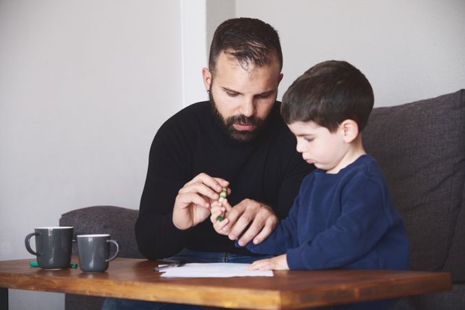 Father and son drawing together