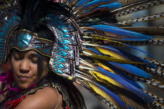 Des Moines, Iowa, USA - September 26, 2015: An Aztec heritage dancer wears traditional headdress