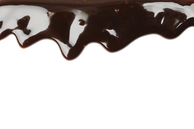 Tasty melted chocolate isolated on studio background