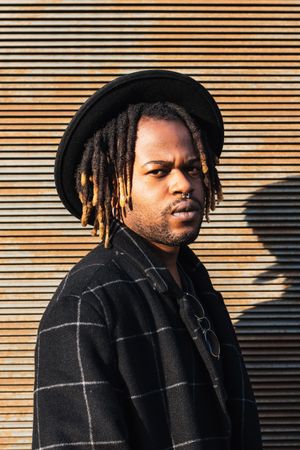 Stylish Black man with dreadlocks on street