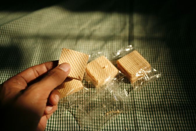 Hand picking up package of wafers