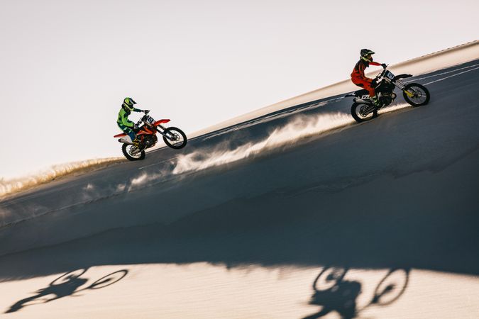 Motocross racers racing in desert