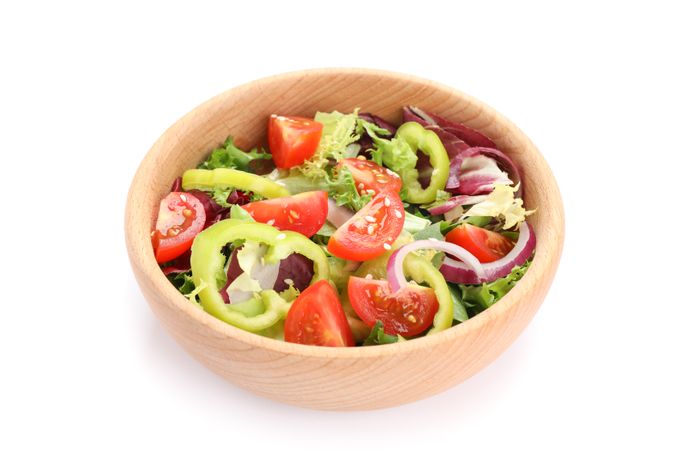 Wooden bowl with fresh salad isolated on blank background