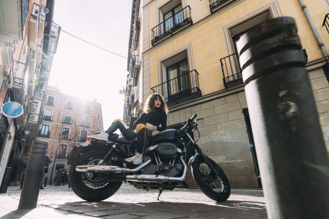 Young woman in custom motorbike