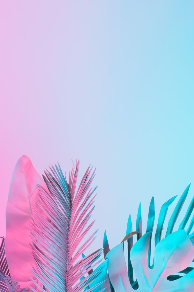 Tropical and palm leaves in vibrant bold gradient holographic colors