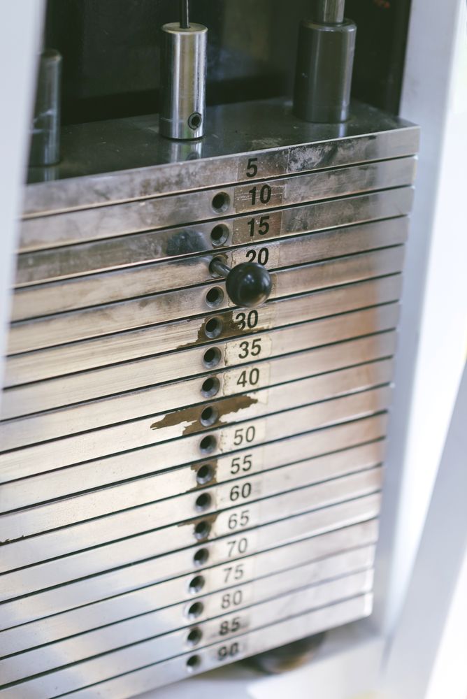 Close up of weights on machine in gym