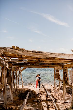 Peaceful lovers embracing on seashore