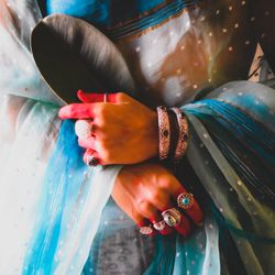 Woman in sari wearing gold bracelet