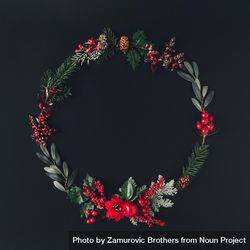 Flat lay of holiday wreath on dark background 0Kg8y0