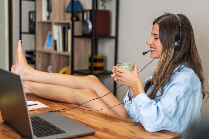 Woman with Headset Relaxing with Coffee at Home Office - Remote Work Lifestyle