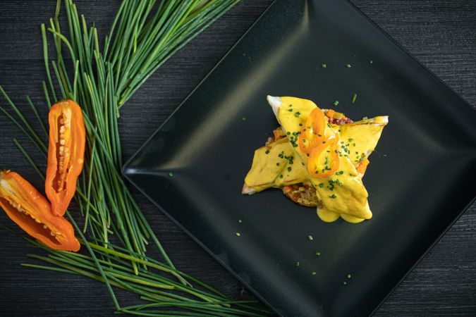 Corvina with yellow pepper sauce in plate