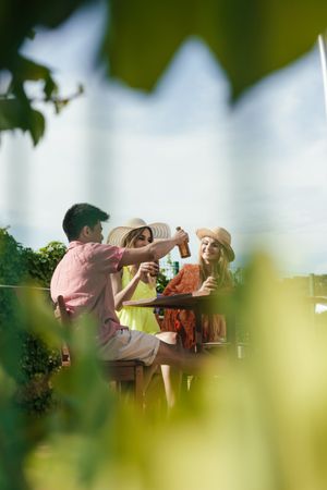 Group of friends drinking beer on the terrace