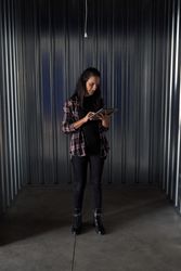 Woman browsing tablet in container