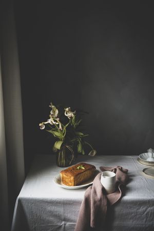 Cake with lemon on table