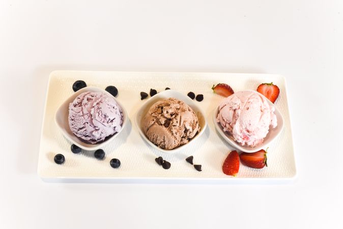 Plate of three different flavored ice cream scoops
