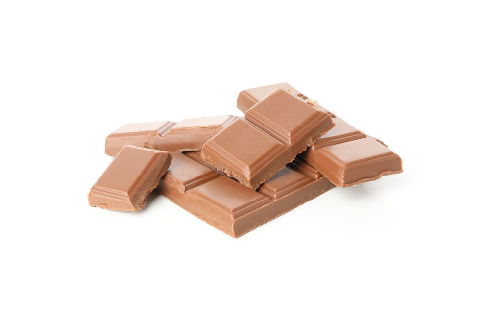 Tasty chocolate pieces isolated on studio background