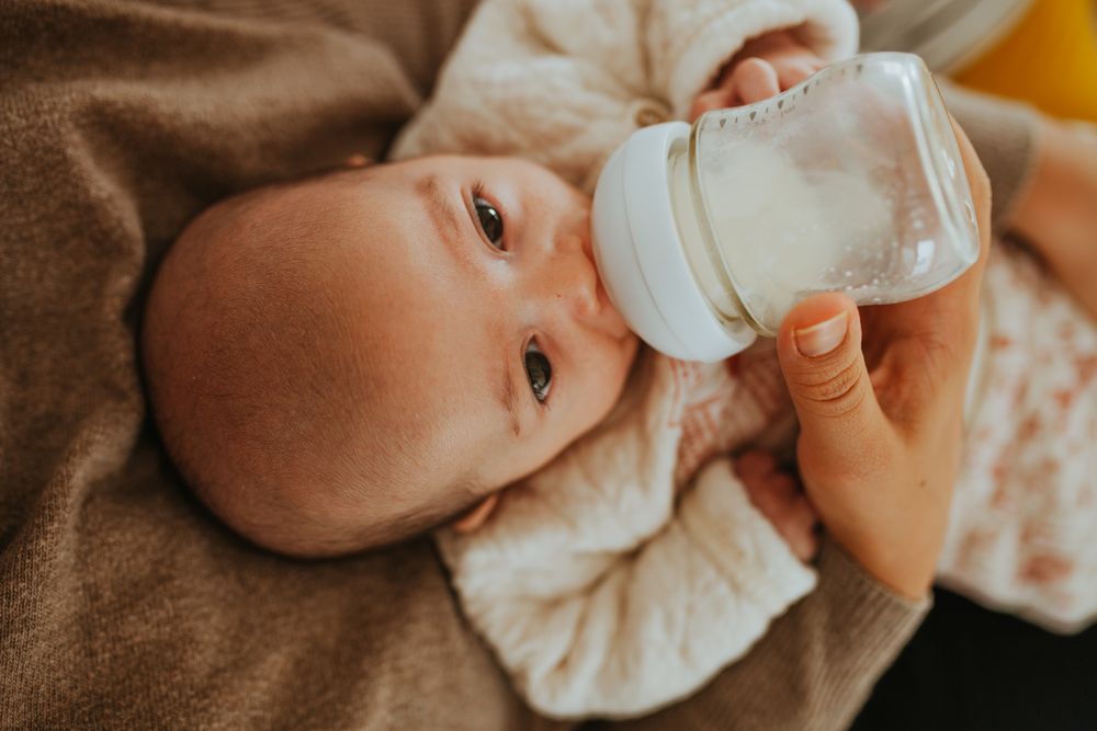 Top view of baby being bottle fed