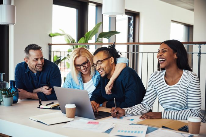 Multi-ethnic group of colleagues enjoying a moment at work