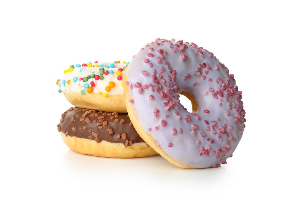 Tasty baked donuts isolated on plain background