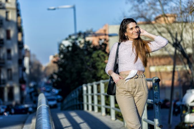 Smiling woman in casual wear going for a stroll in the city