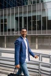 Man walking through financial area with briefcase