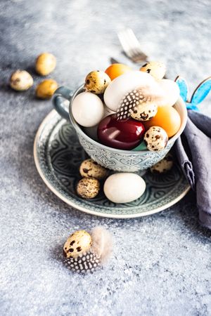 Easter table setting with bowls of different sized eggs