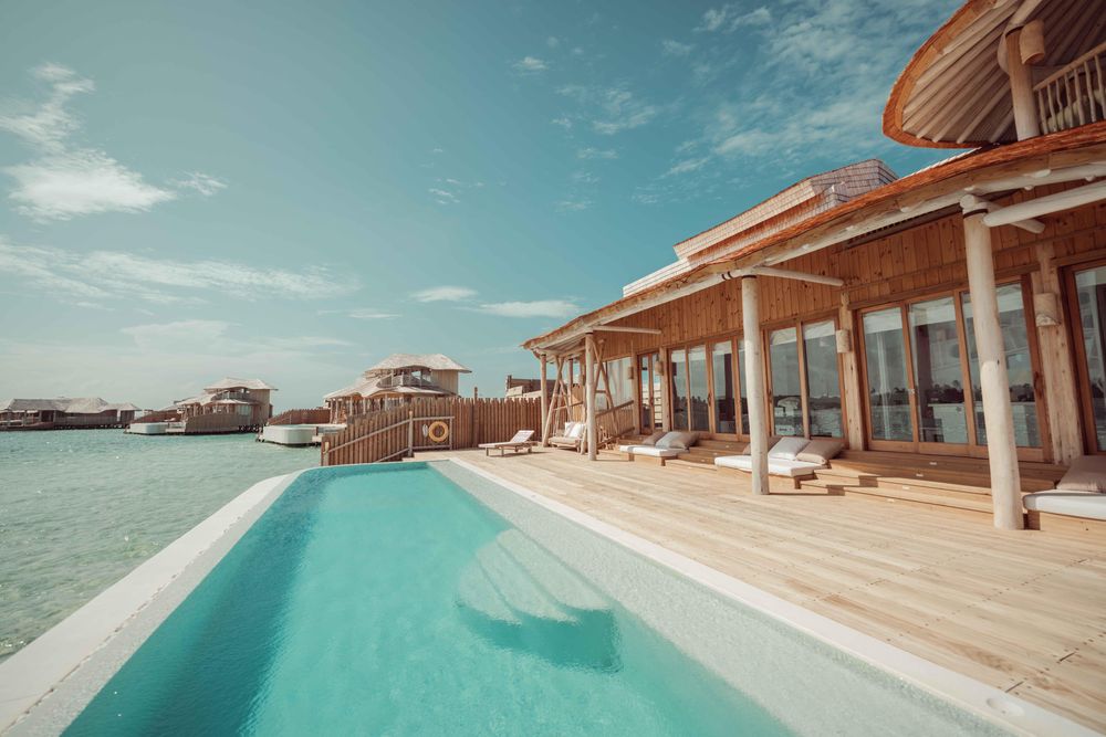Swimming pool on the edge of the beach in Maldives