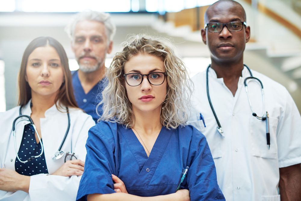 Multi-ethnic group of serious medical professionals