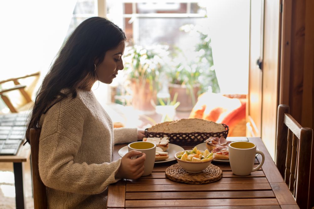 woman having breakfast at home