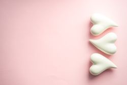 Pink pastel table with ceramic light heart ornaments