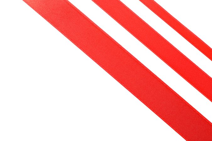 Red ribbons isolated on blank background. Gift concept