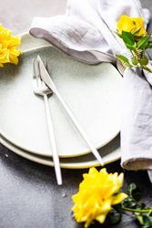 Elegant table setting with yellow roses