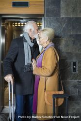 Cute mature couple having a tender moment outside of an elevator 5Rza25