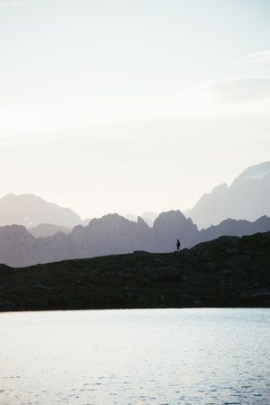 Majestic mountain landscape with human silhouette