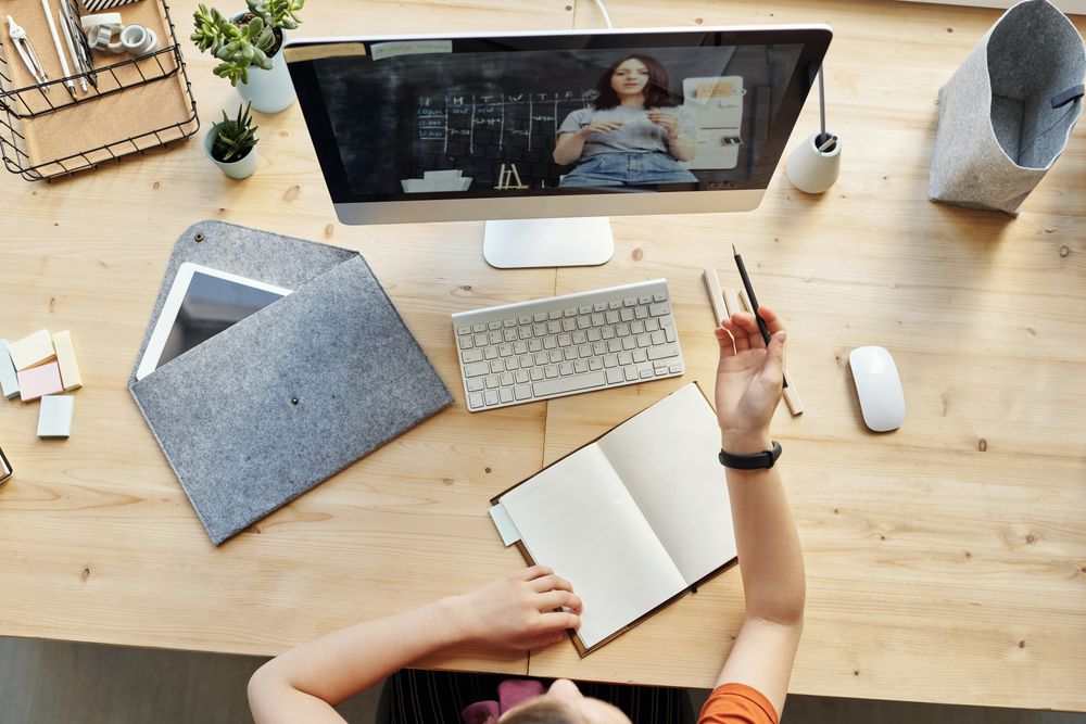 Top view of student watching an online tutorial