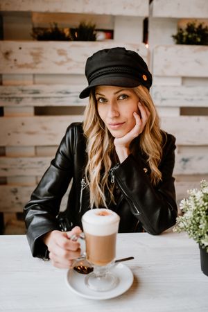 Woman drinking coffee from a glass