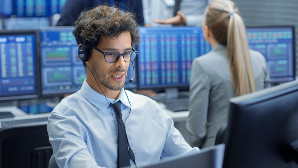 Stock Trader Making Sales with a Headset.